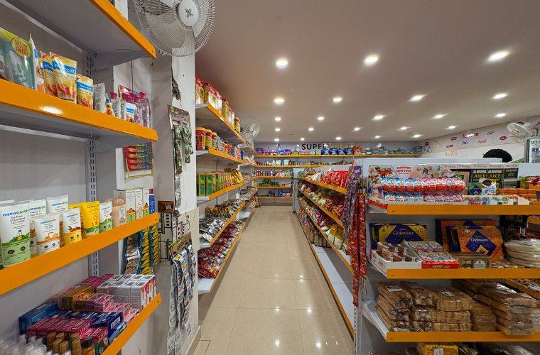 Wide supermarket aisle inside SuperKirana store designed for smooth customer movement and easy product access